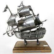A silver-plated model of the Portuguese ship Seculo XV, on wooden plinth, height 28 cm.