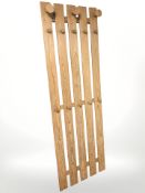 A Scandinavian pine wall mounted coat rack,