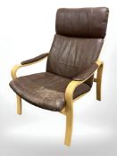 A 20th century Danish bent wood brown stitched leather lounge armchair