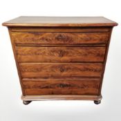 A 19th century continental burr walnut four drawer chest,