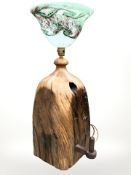A heavy rustic reclaimed pine lamp base with decorative art glass shade,