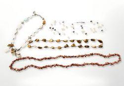A multi-strand pearl necklace together with three further gemstone necklaces.