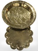 An embossed brass charger, diameter 55 cm,