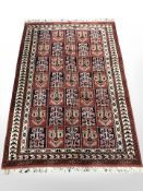 A Bokhara rug of compartmentalised design,