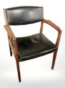 A 20th century Danish Duba teak and black vinyl armchair.
