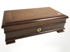 A mahogany and walnut veneered jewellery casket, width 36 cm.