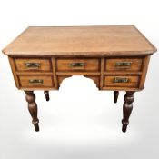 A 19th century Continental walnut pine writing desk fitted with five drawers,