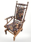 A bobbin turned rocking chair in floral upholstery