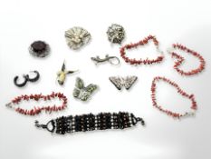 Four red coral bracelets together with a cuff bracelet, marcasite lizard brooch, butterfly brooches,
