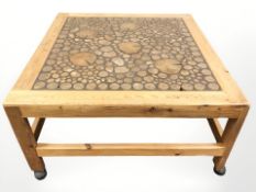A pine coffee table with specimen wood top,