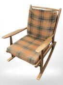 A 20th century teak rocking chair
