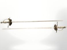 A pair of 19th century Continental court swords, with 83 cm engraved blades,