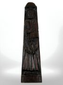A carved oak panel depicting a saint, length 70 cm.