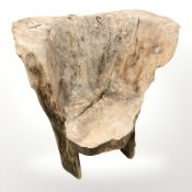 A rustic burr wood tree trunk armchair,