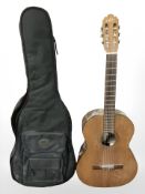 An Aria classical guitar with soft carry case