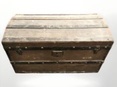 An antique canvas and wooden bound trunk, width 86 cm.
