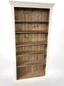 A painted pine open bookcase,