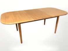 A 20th century teak extending dining table with leaf, overall 197 cm x 97 cm x 72 cm,