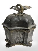A 19th century lead tobacco jar surmounted by eagle, height 16 cm.