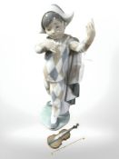 A Lladro figure of a boy violinist,