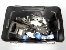 A circular table saw, router, spools of rope and other hardware.