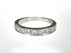 An 18ct white gold diamond half-eternity ring,