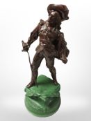A painted metal statue of a cavalier, height 30 cm.