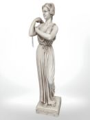 A contemporary figure of a maiden standing on plinth, height 48 cm.