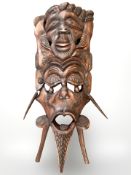 A large African carved wooden mask,