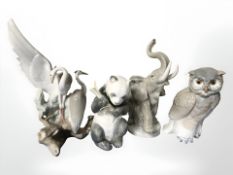 Four Nao animal figures including owl, panda, elephant and herons, tallest 26 cm.