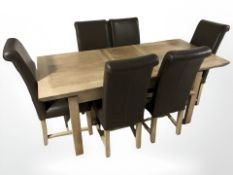 A contemporary oak extending dining table, with leaf total length 200 cm x 90 cm x 80 cm,