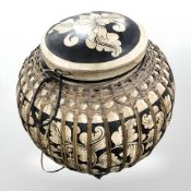 An oriental wicker bound barrel,