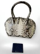 A contemporary snake skin handbag and a blue ostrich skin wallet