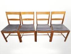 Four 20th century Danish teak dining chairs