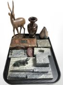 A polished granite desk stand surmounted by a bear, similar desk blotter and letter rack,