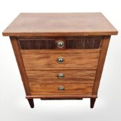 A Continental mahogany four drawer chest,