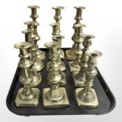 Twelve various Victorian brass candlesticks, tallest 25 cm.