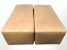 A pair of contemporary tan leather upholstered stools retailed by Ralph Lauren,