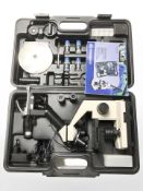 A Bresser Biolux NV digital microscope, in carry case with accessories and instructions.