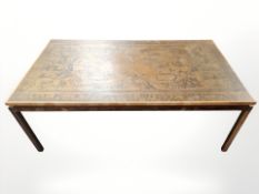 A Continental rectangular coffee table with embossed metal inset top depicting the globe,