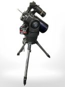 A Meade computer control telescope on tripod.
