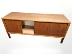 A teak sliding door low sideboard,
