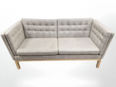 A late 20th century Scandinavian three seater settee in grey fabric,