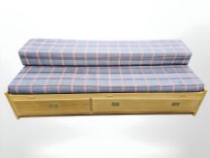 A 20th century Scandinavian oak veneered storage day bed,