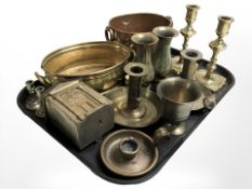 A group of brass candlesticks, a pair of Indian benares brass vases, copper and brass dishes,