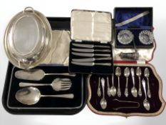 A group of silver and plated wares including silver-handled butter knives,
