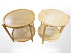 Two circular beech trolleys on castors.