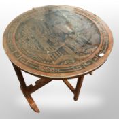 An oriental carved circular occasional table and pair of wicker chairs
