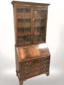 A reproduction mahogany bureau bookcase, 96 cm x 48 cm x 214 cm.