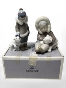 A Lladro figure 'Eskimo Boy' No. 5238, boxed, and a further similar figure.